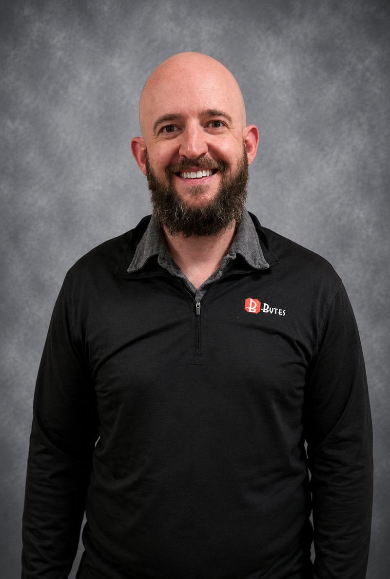 Portrait of Ben Sandine, Professional Services Engineer at Bytes