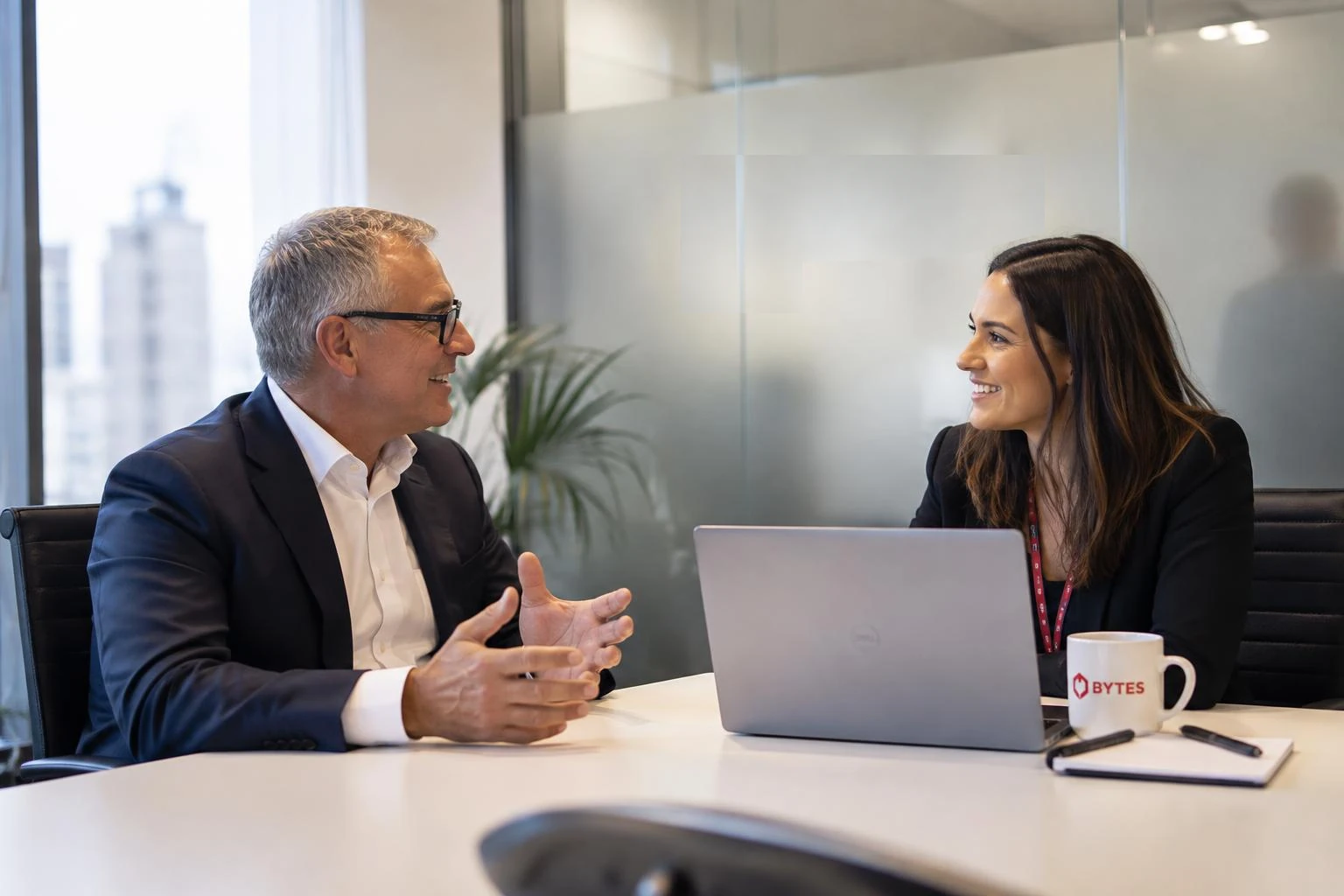 A Bytes advisor discussing technology plans with a business leader